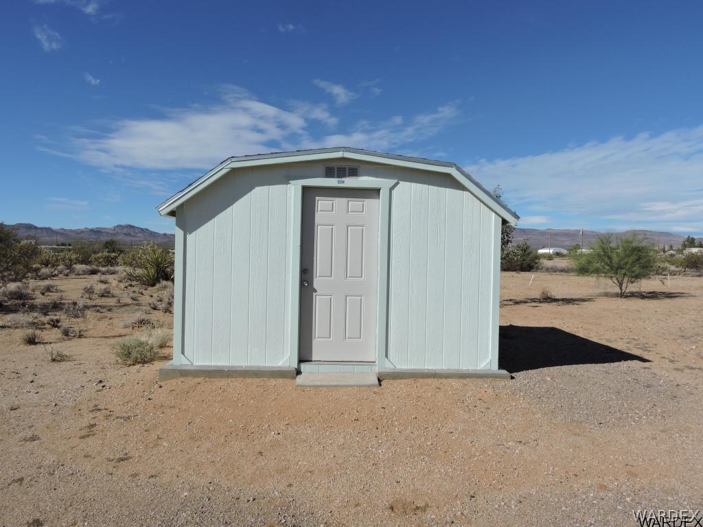 4053 Cove Road Golden Valley, AZ 86413 - Photo 5 of 20 a front view of a house with a yard