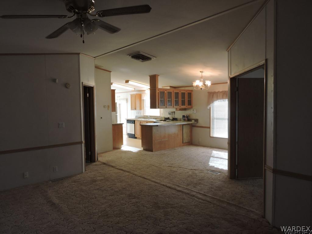 4053 Cove Road Golden Valley, AZ 86413 - Photo 9 of 20 a large kitchen with cabinets and stainless steel appliances