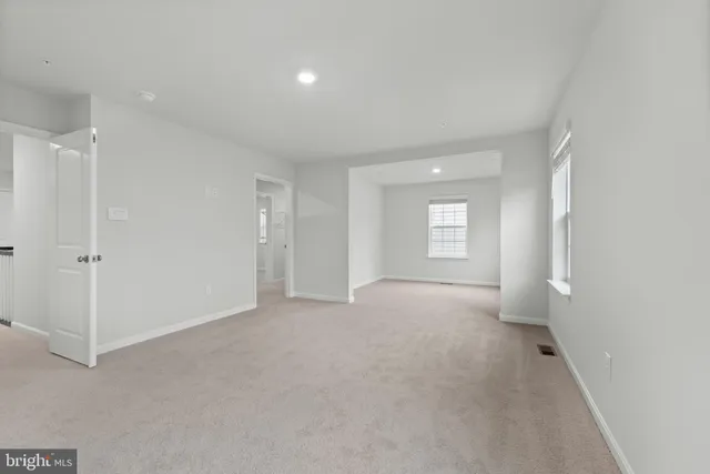 a view of empty room with windows