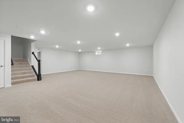 an empty room with a stairs