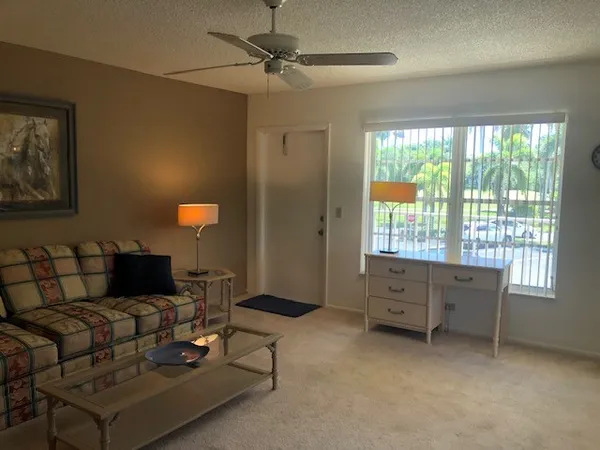 a living room with furniture and a window