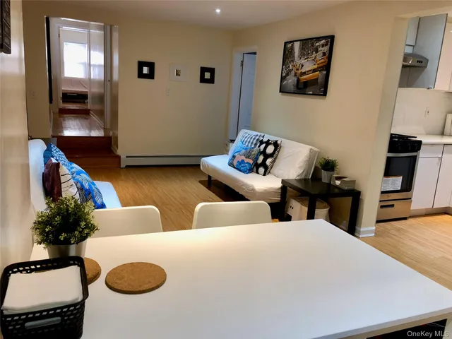 a living room with couches and a flat screen tv