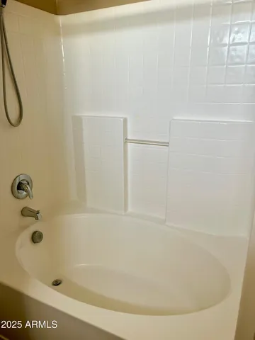 a bathroom with a bath tub