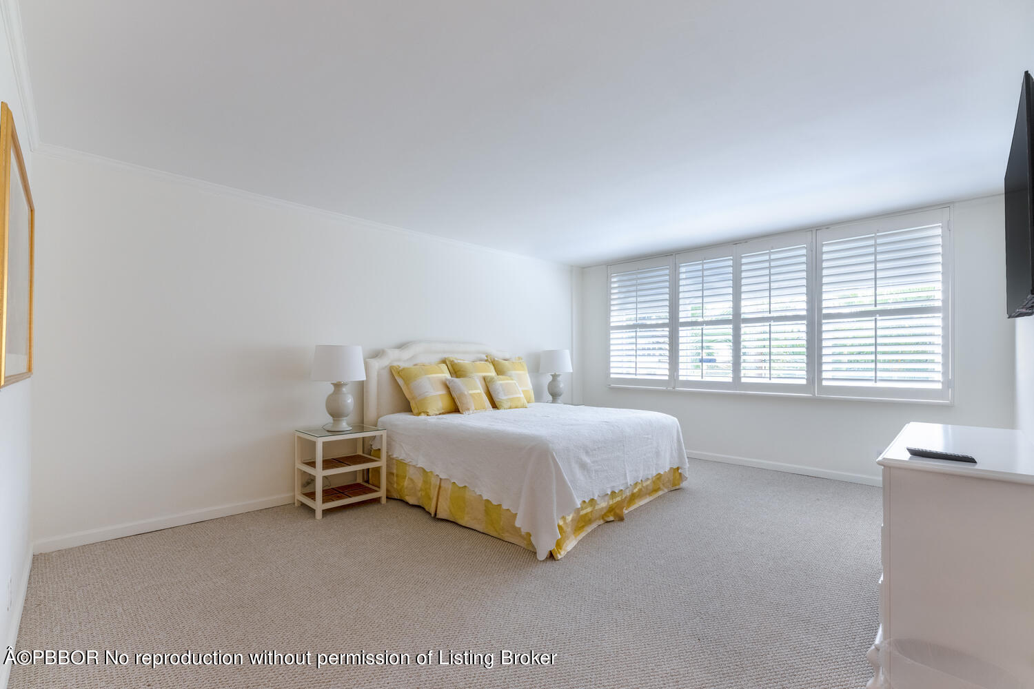 434 Chilean Avenue, Unit 2D Palm Beach, FL 33480 - Photo 11 of 19 a spacious bedroom with a bed and a large window