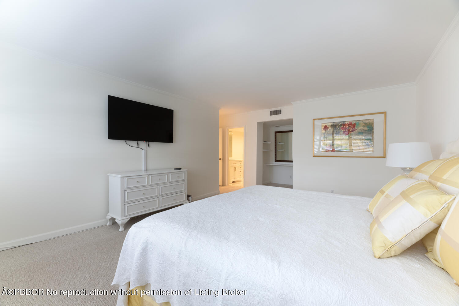 434 Chilean Avenue, Unit 2D Palm Beach, FL 33480 - Photo 12 of 19 a bedroom with a bed and a flat screen tv