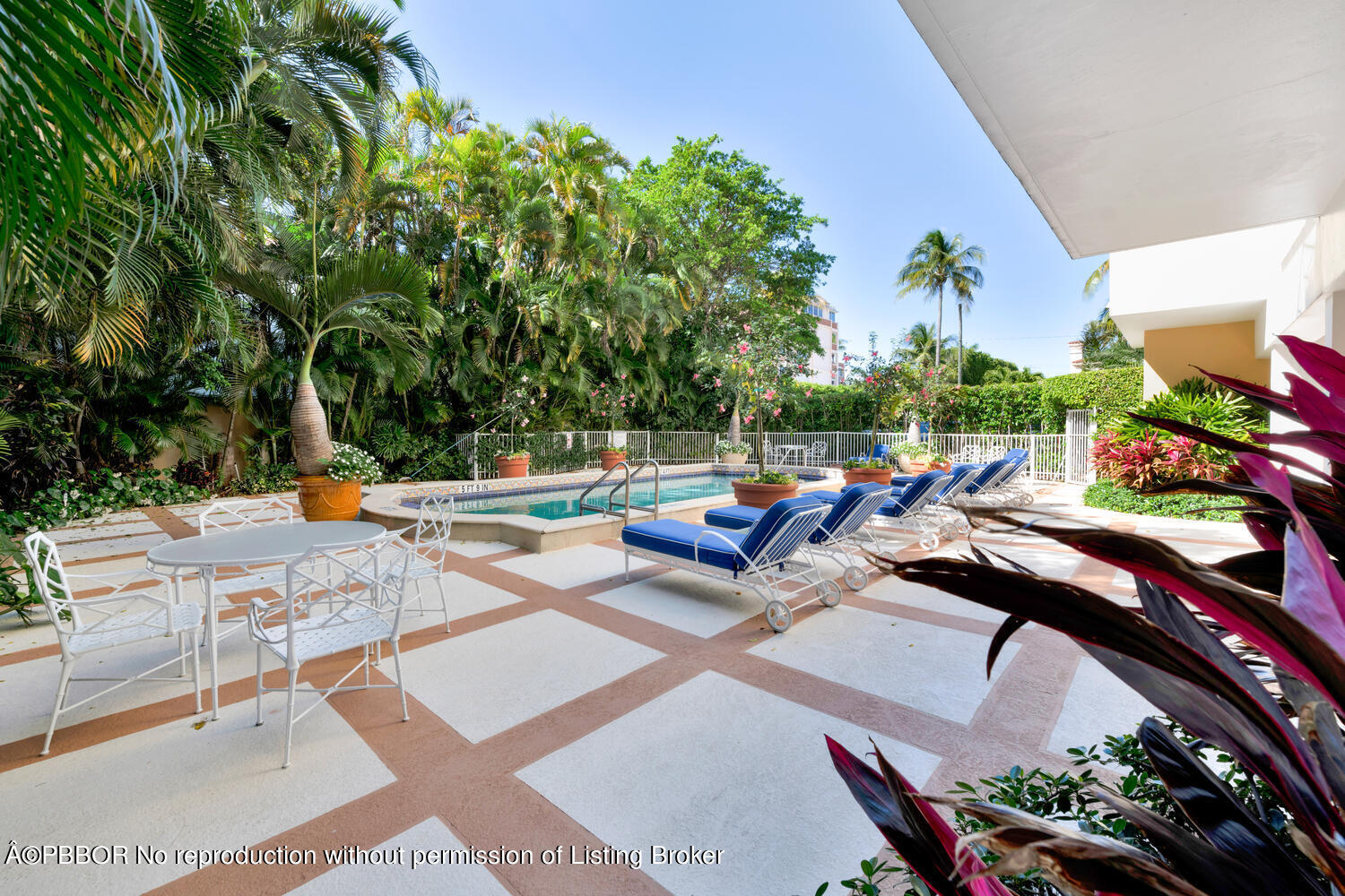 434 Chilean Avenue, Unit 2D Palm Beach, FL 33480 - Photo 16 of 19 a view of a backyard with sitting area