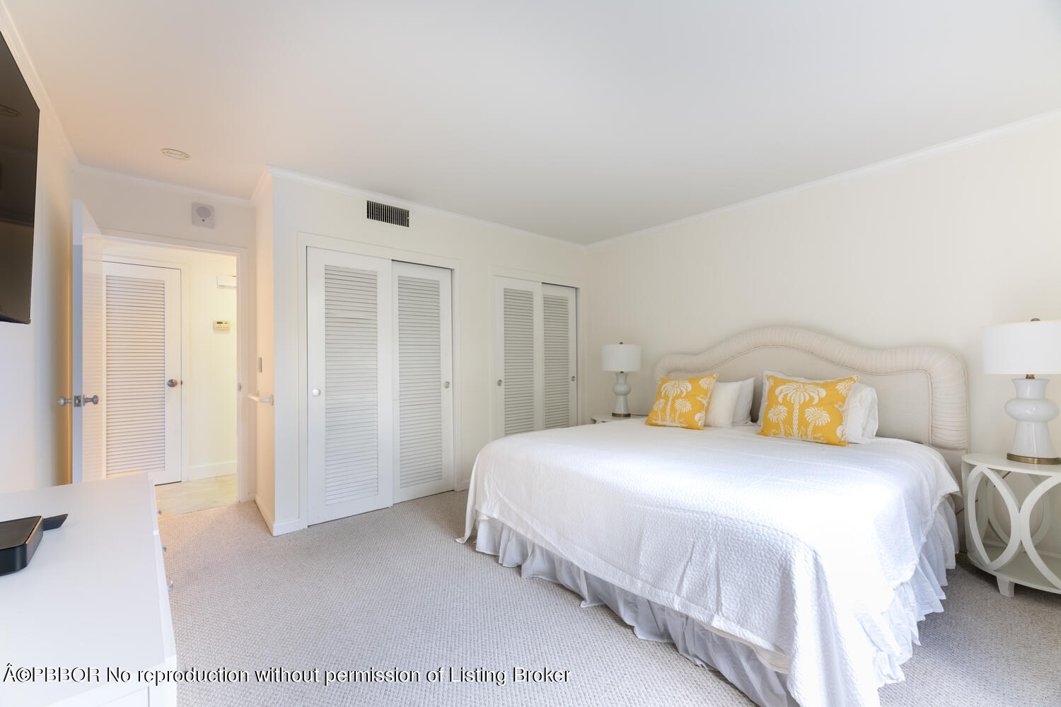 434 Chilean Avenue, Unit 2D Palm Beach, FL 33480 - Photo 9 of 19 a bedroom with a bed and a cabinets