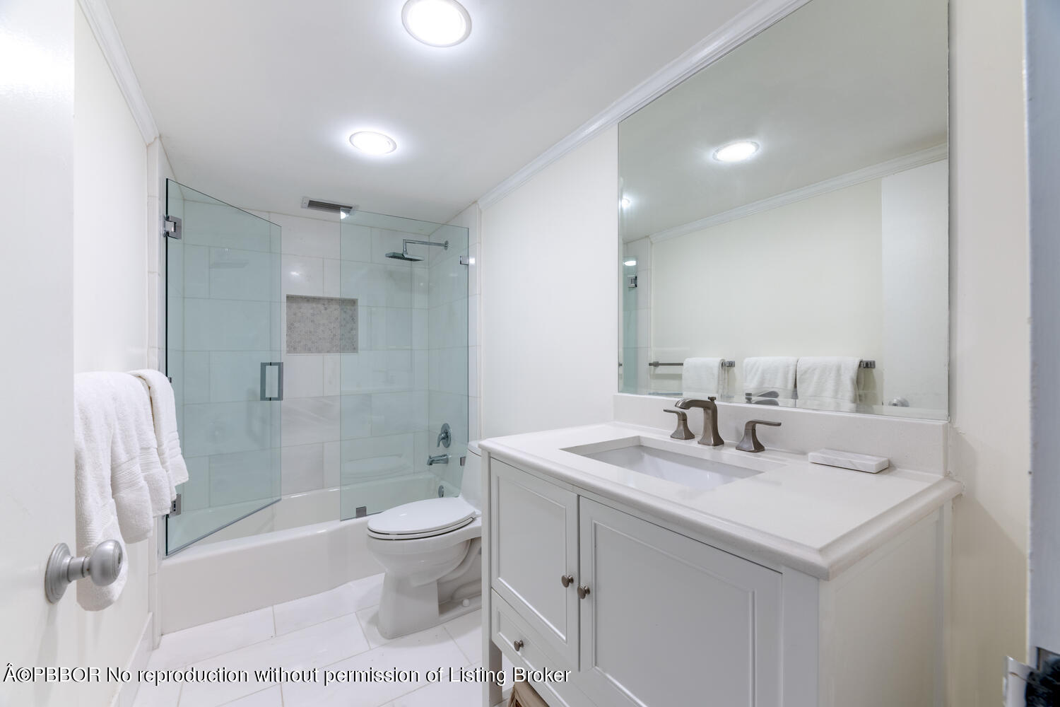 434 Chilean Avenue, Unit 2D Palm Beach, FL 33480 - Photo 10 of 19 a bathroom with a sink a toilet and shower