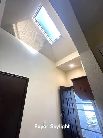 a view of a backyard with sitting area