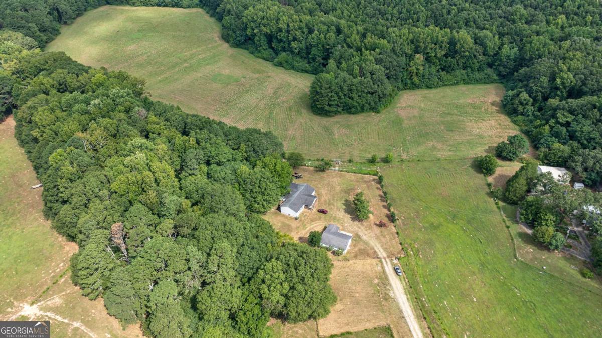 1230 Treadwell Bridge Road, Unit LOT 5 Statham, GA 30666 - Photo 1 of 1 an aerial view of residential house with outdoor space and trees all around