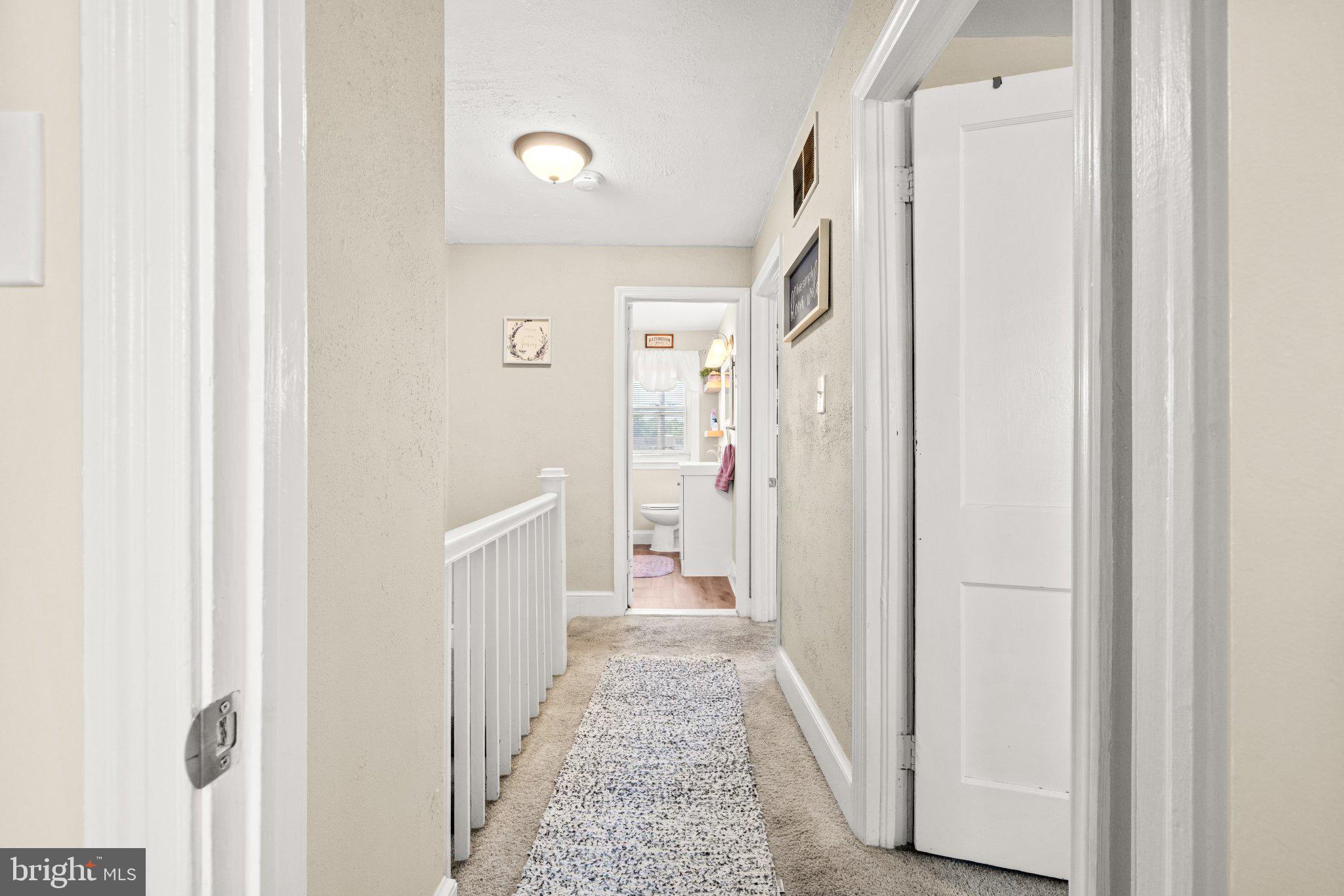 234 West Edgevale Road Baltimore, MD 21225 - Photo 7 of 45 Bright and inviting hallway retreat.