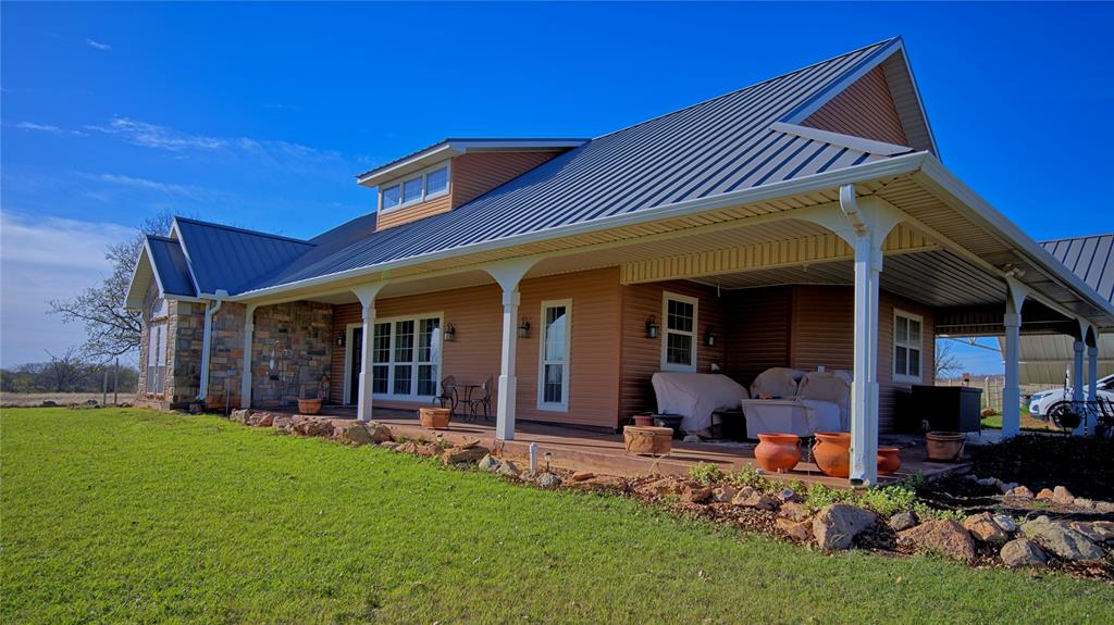 4460 Hildreth Pool Road Bowie, TX 76230 - Photo 2 of 40 a view of a house with backyard porch and furniture