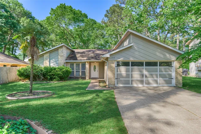 a front view of a house with a yard and porch
