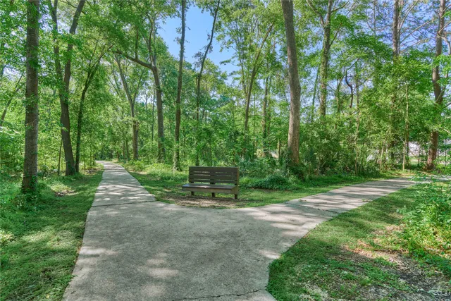 a view of a house with yard and green space