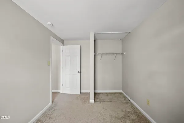 an empty room with closet
