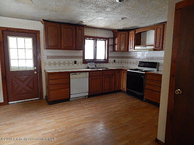 3 Rr Hop Bottom, PA 18824 - Photo 6 of 13 a kitchen with stainless steel appliances granite countertop wooden cabinets a stove a sink and dishwasher