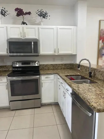 a kitchen with a stove and a sink