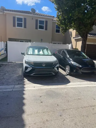 a car parked in front of a house