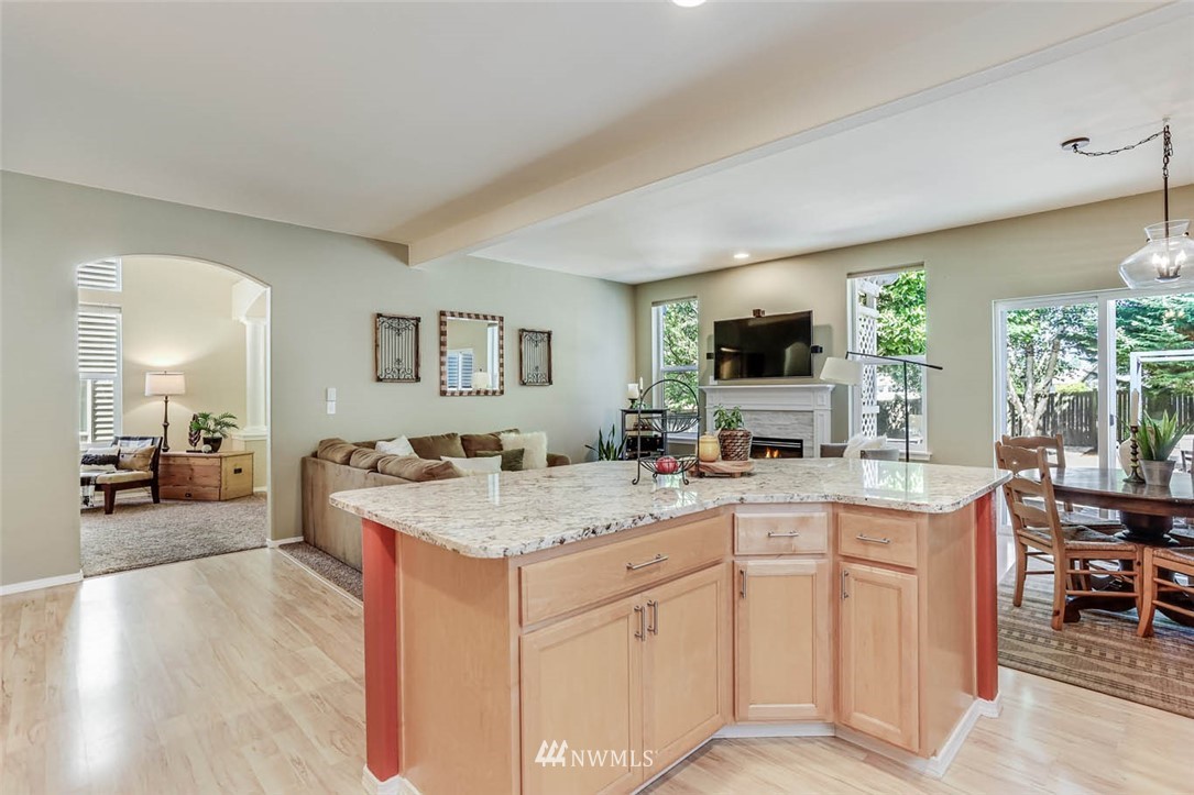 4331 147th Place Southeast Bothell, WA 98012 - Photo 8 of 33 a open kitchen with sink cabinets and wooden floor