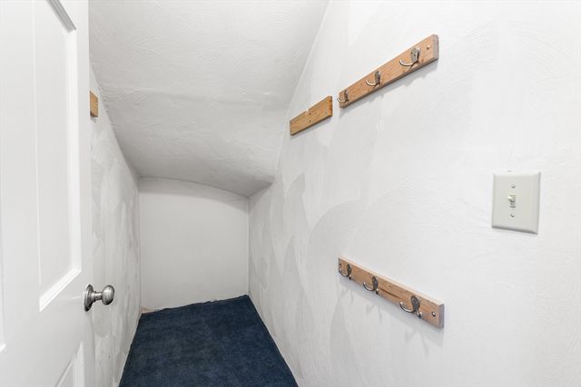 a view of a hallway with stairs