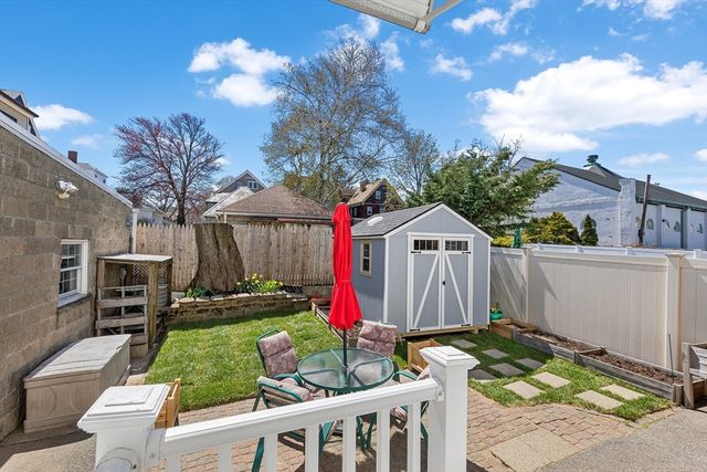 a view of house with backyard