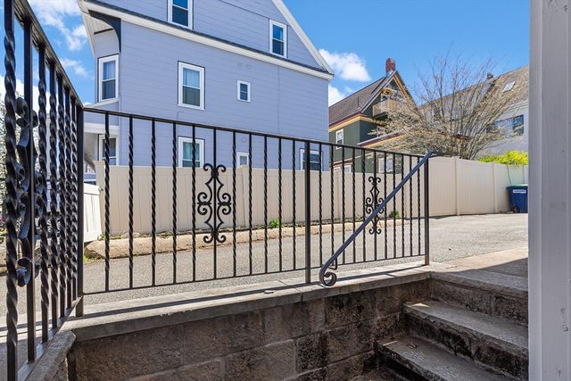 a view of a balcony with a floor to ceiling window
