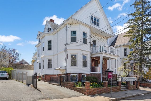 a front view of a building with street view