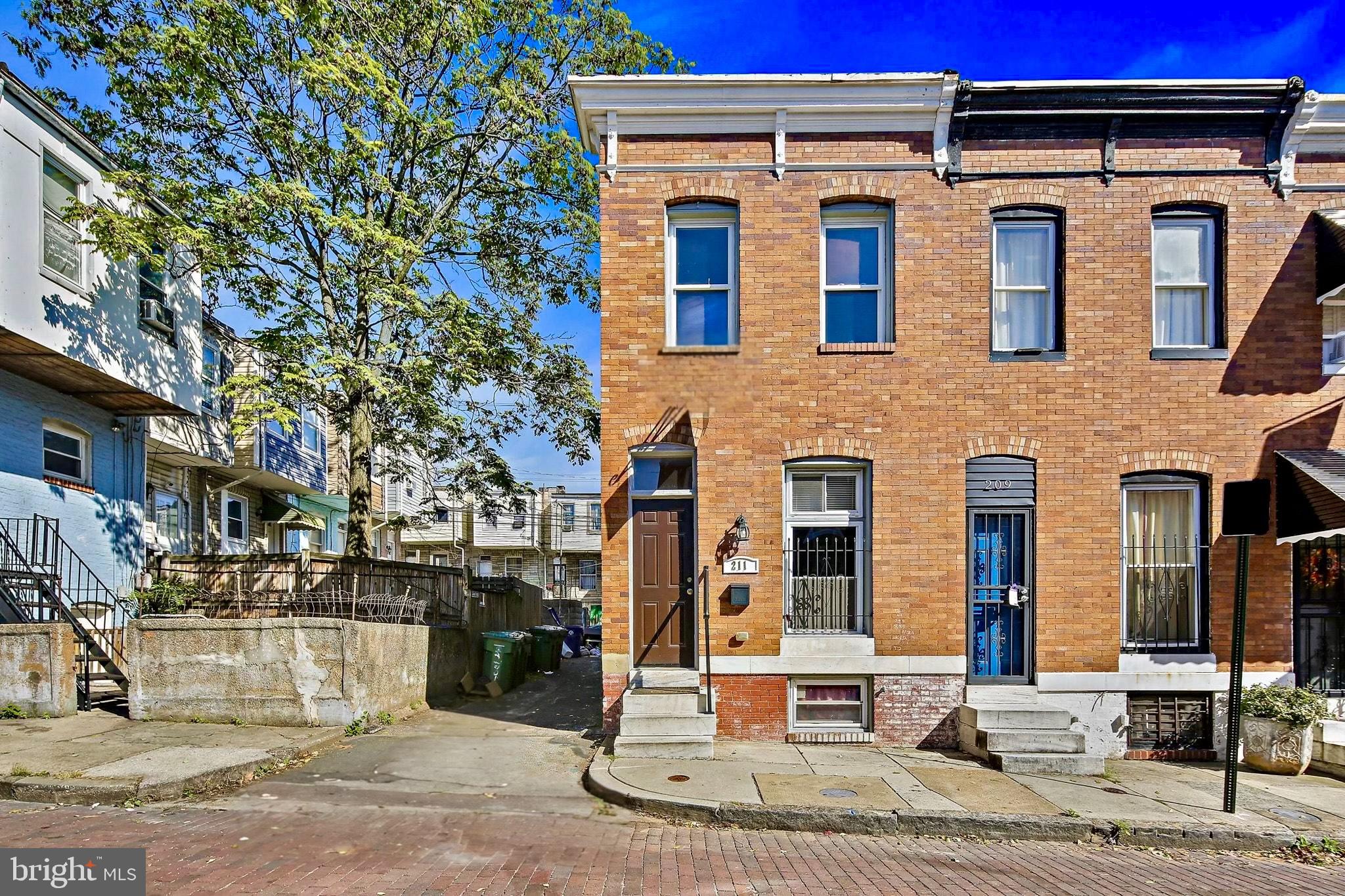211 North Streeper Street Baltimore, MD 21224 - Photo 2 of 33 a front view of a multi story residential apartment building