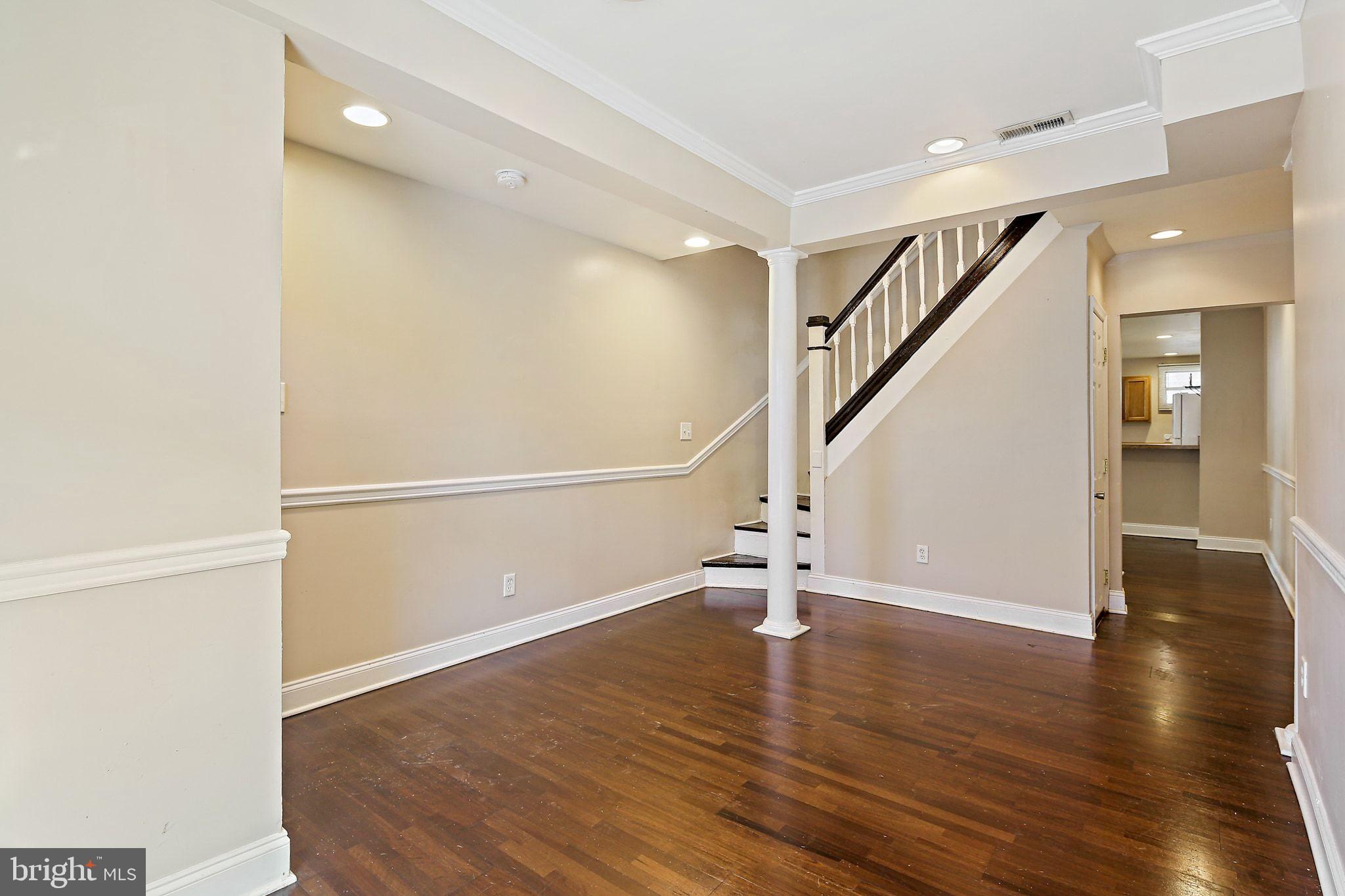 211 North Streeper Street Baltimore, MD 21224 - Photo 5 of 33 a view of an entryway with wooden floor