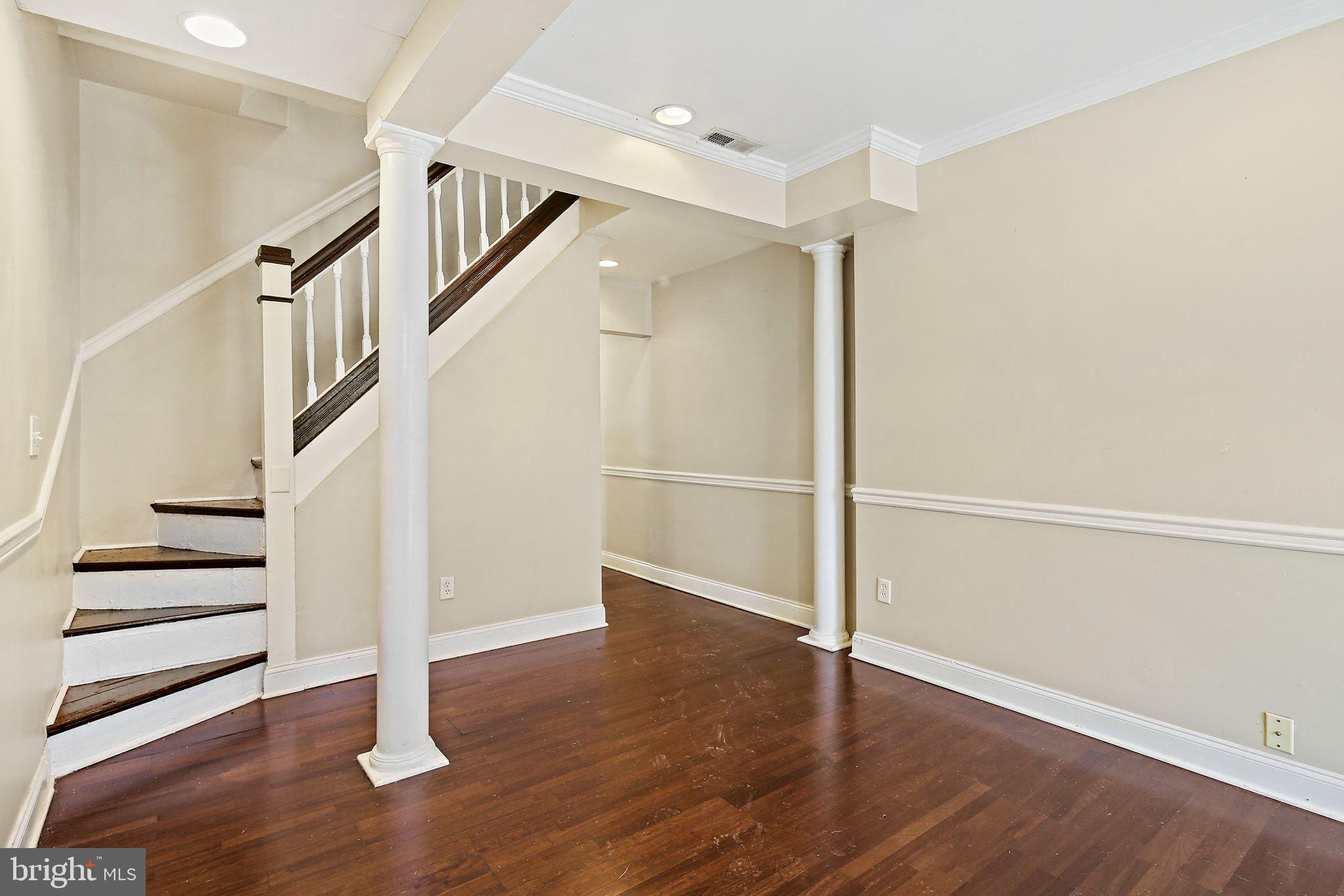 211 North Streeper Street Baltimore, MD 21224 - Photo 6 of 33 a view of entryway with wooden floor