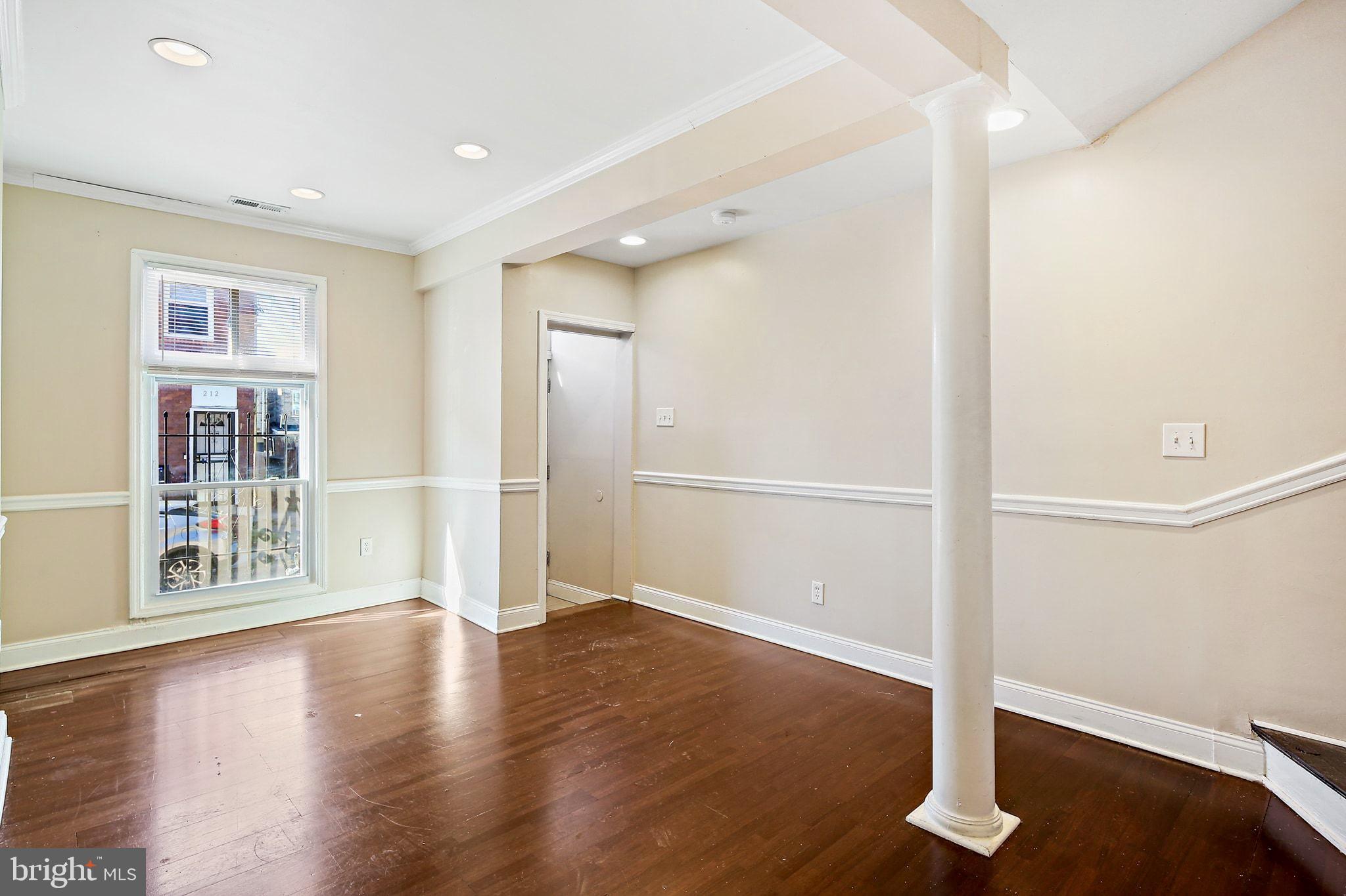 211 North Streeper Street Baltimore, MD 21224 - Photo 7 of 33 a view of entryway with wooden floor