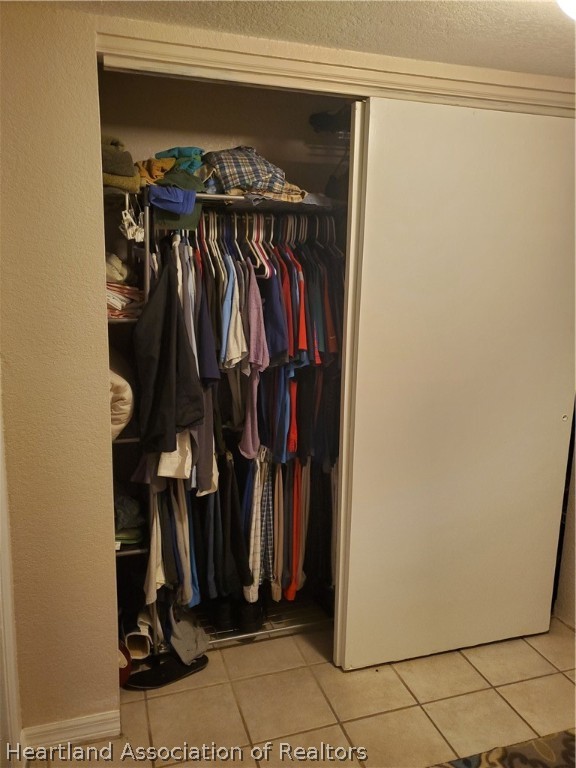 105 Golf Villas Court Northwest Lake Placid, FL 33852 - Photo 7 of 13 a view of walk in closet with clothes and shoes