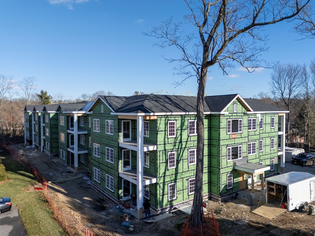 93 Bedford Street, Unit 201 Lexington, MA 02420 - Photo 4 of 7 a view of a house with a yard