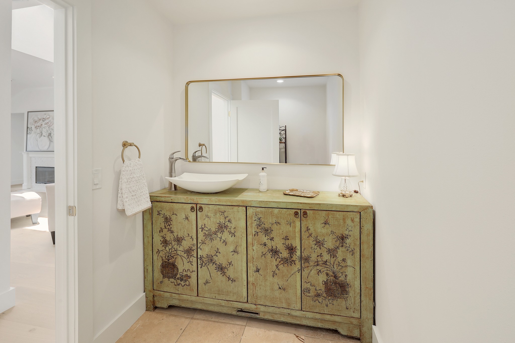 7705 Jester Boulevard Austin, TX 78730 - Photo 22 of 36 An exquisite antique-inspired vanity featuring a contemporary vessel sink creates a unique powder room statement.