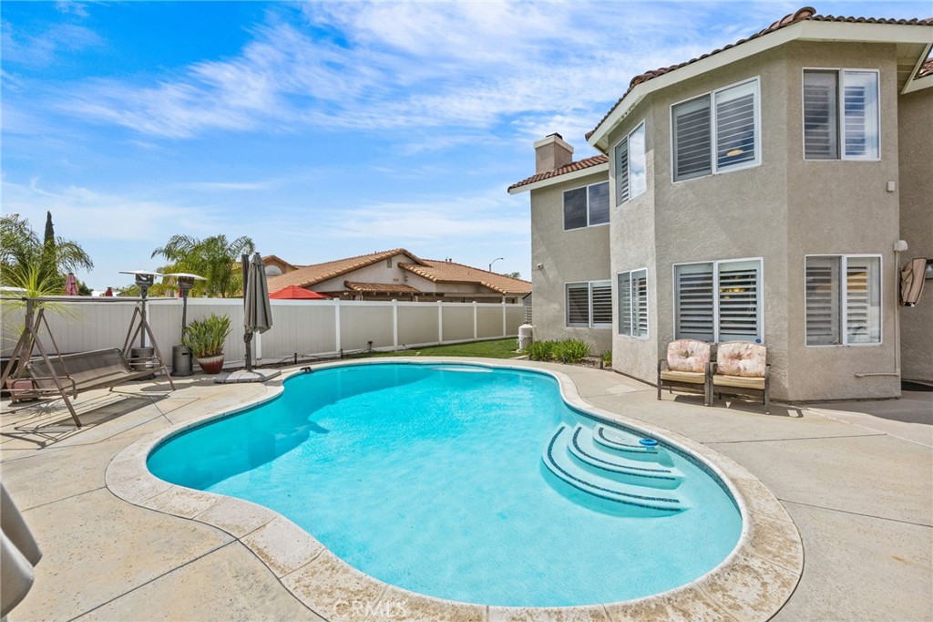 20257 Edmund Road Riverside, CA 92508 - Photo 37 of 53 a view of a house with swimming pool
