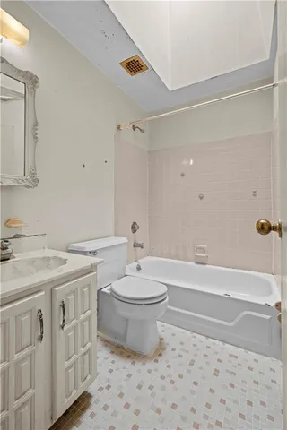 front view of a brick house with a yard