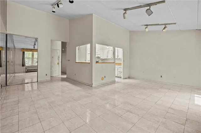 a view of a kitchen with storage and utility room