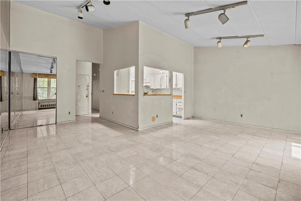 101-06 4th Avenue, Unit 26E Brooklyn, NY 11209 - Photo 2 of 16 a view of a kitchen with storage and utility room