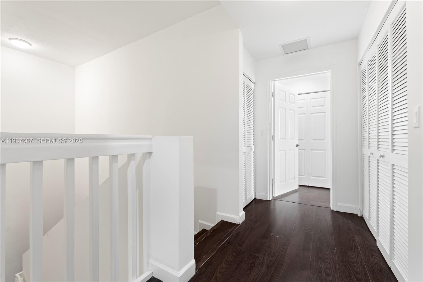 8395 Southwest 73rd Avenue, Unit 115 Miami, FL 33143 - Photo 13 of 26 a view of a hallway with wooden floor