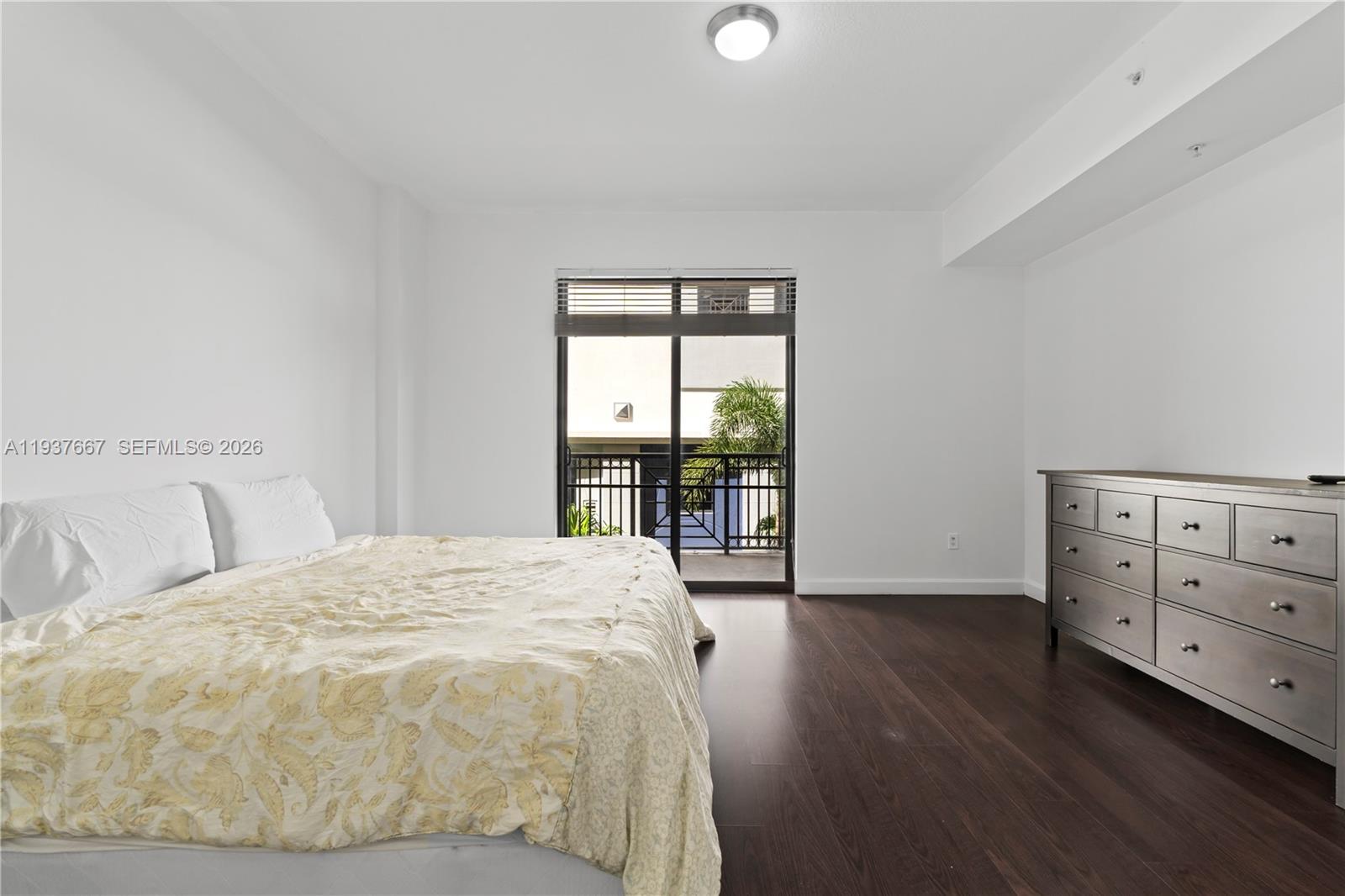 8395 Southwest 73rd Avenue, Unit 115 Miami, FL 33143 - Photo 15 of 26 a spacious bedroom with a bed and a window