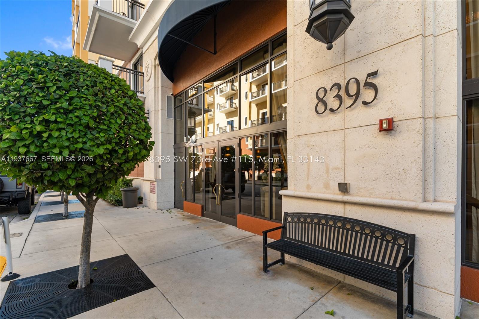 8395 Southwest 73rd Avenue, Unit 115 Miami, FL 33143 - Photo 2 of 26 a view of a porch with a table and chairs