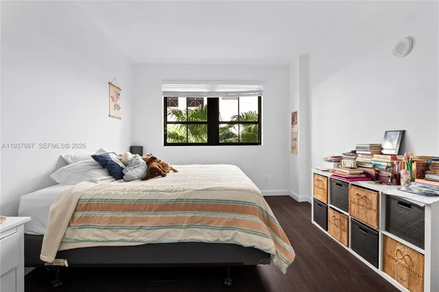 a bed room with a bed and a window