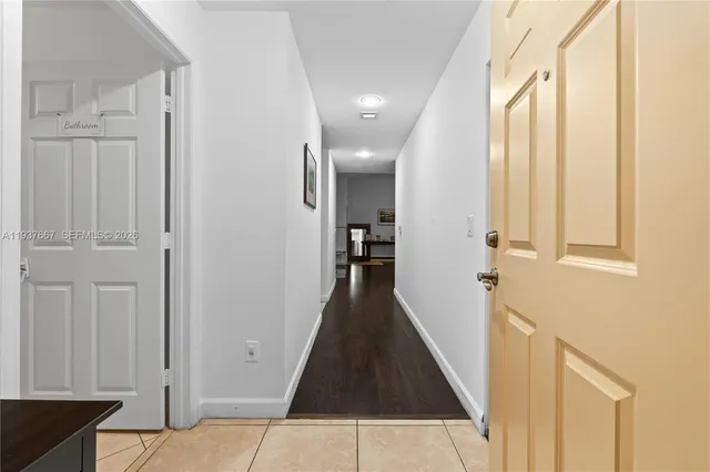 a view of a hallway with windows