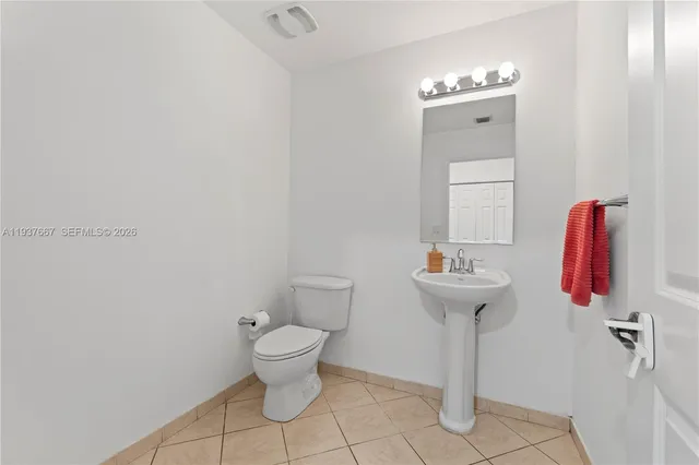 a bathroom with a sink and toilet