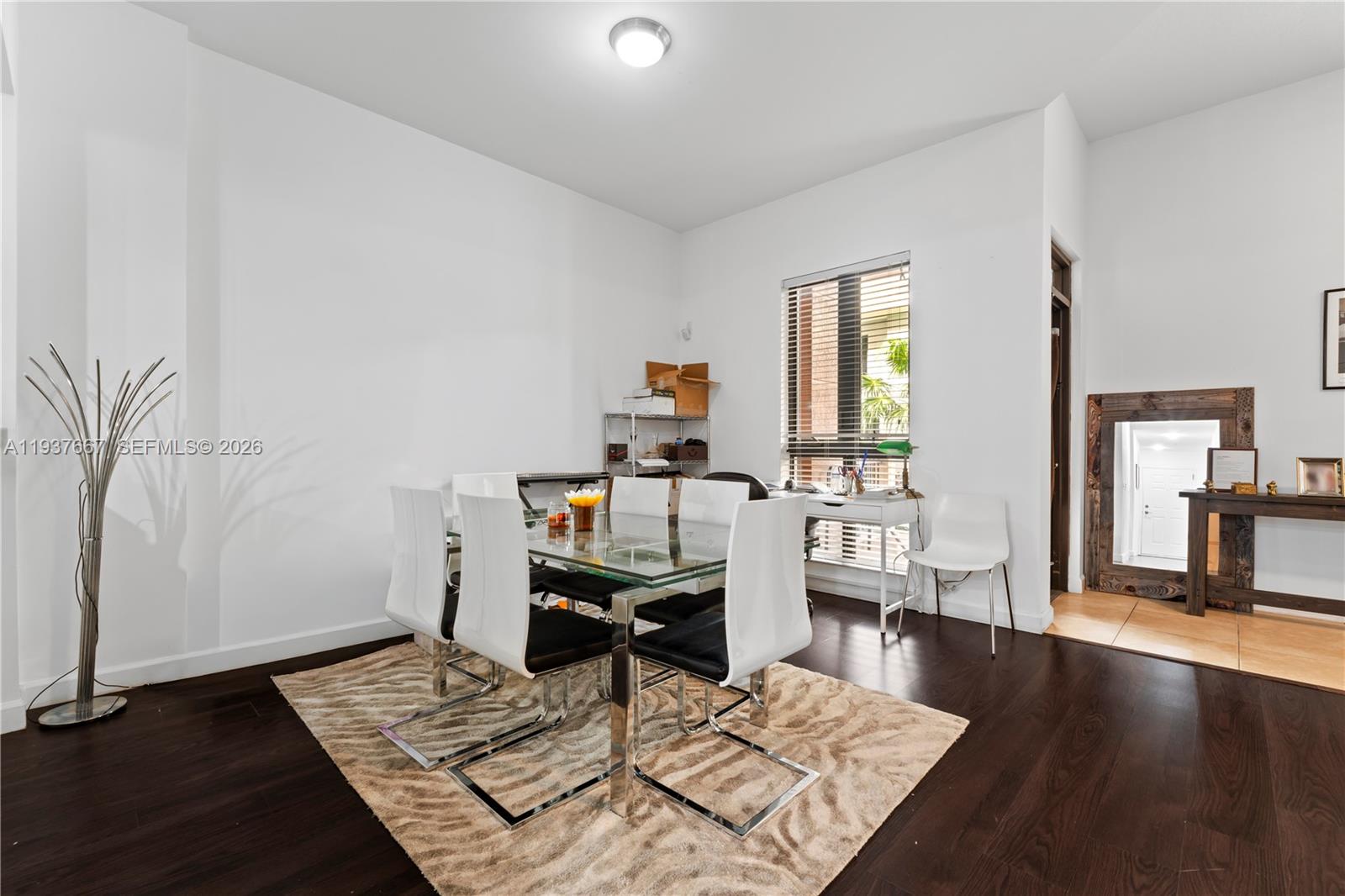 8395 Southwest 73rd Avenue, Unit 115 Miami, FL 33143 - Photo 10 of 26 a living room with furniture and a wooden floor