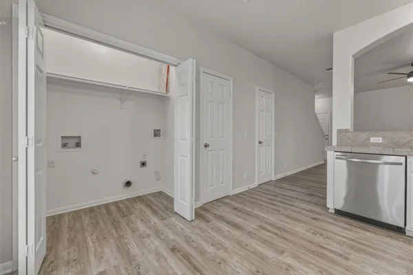 a view of a kitchen with wooden floor