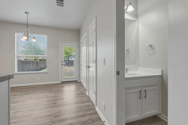a view of a bathroom from the hallway