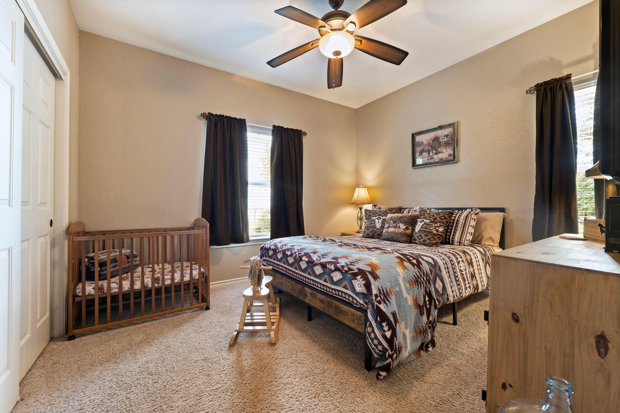 19000 Farm To Market Road 971 Granger, TX 76530 - Photo 24 of 40 Bedroom 3 - Windows on two walls allow options for natural light and multiple times of day.