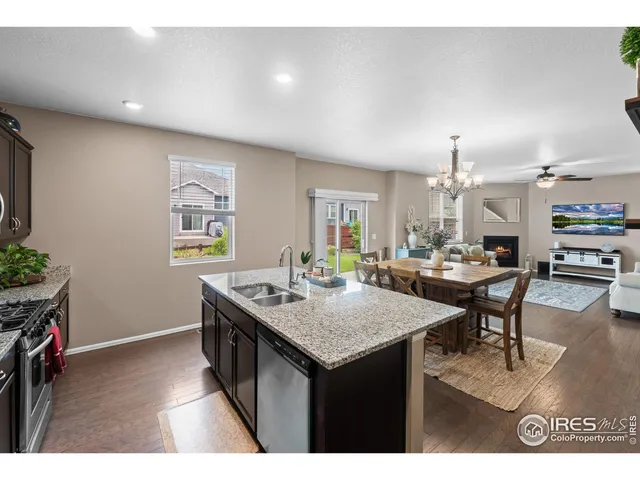 a kitchen with a table and chairs