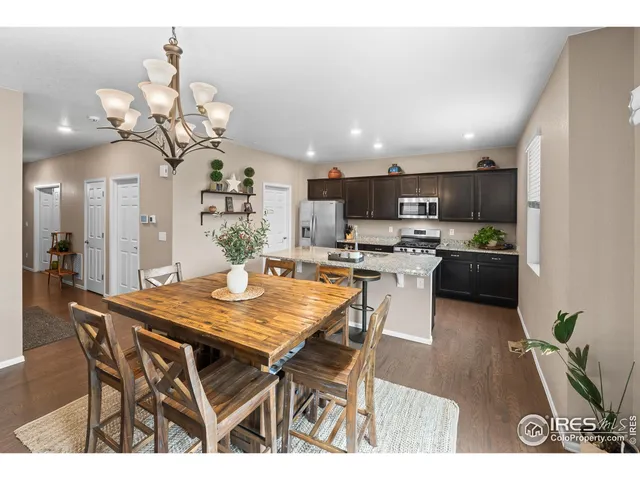 a kitchen with a table and chairs in it